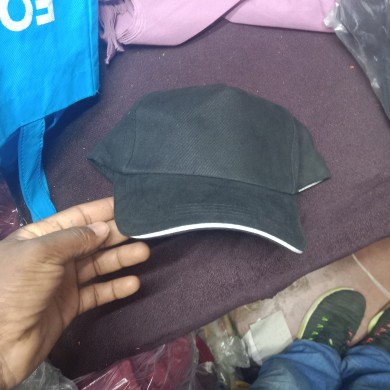 Black Plain Cap With White Piping in Kenya